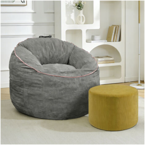 Poltrona a sacco ergonomica con tasca laterale e poggiapiedi abbinato, ideale per soggiorno o angolo lettura, colore grigio.