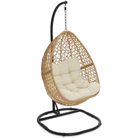 Poltrona moon traforata in rattan con cuscino ecrù