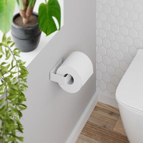 Portarrollos Adhesivo para baño fabricado en acero y acabado blanco mate Peso máx.: 1,5kg Medidas 13x3x7cm Incluye adhesivo extra fuerte y tornillos para que elijas como fijarlo a la pared -