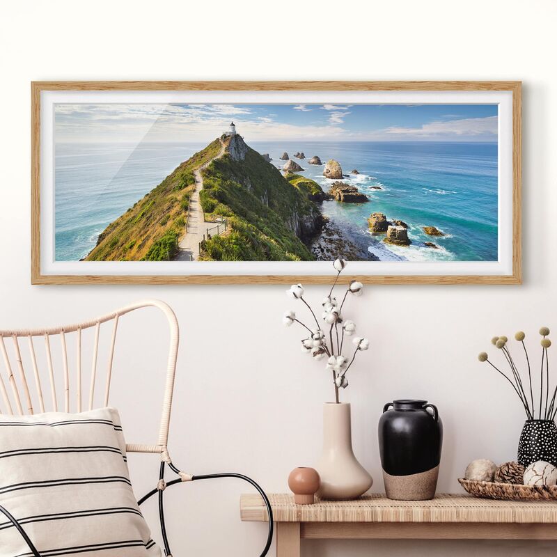 

Póster enmarcado - Nugget Point Lighthouse E Mare Zelanda Dimensión LxA: 50cm x 130cm, Marco: Roble