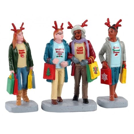 Ragazze cha fanno shopping natalizio statuette in poliresina per villaggio di Natale
