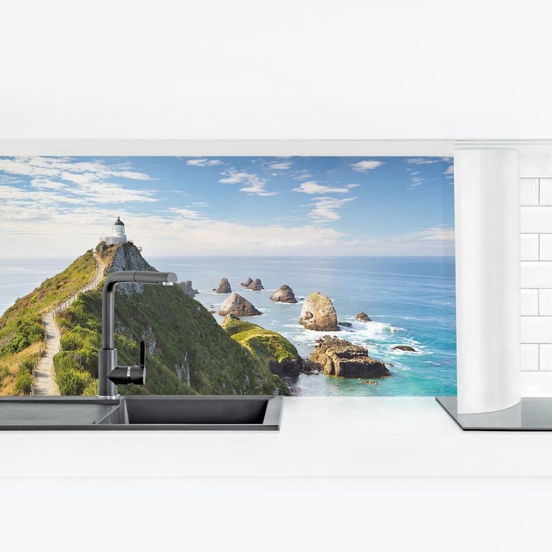 

Revestimiento pared cocina - Nugget Point Lighthouse And Sea New Zealand Dimensión LxA: 40cm x 140cm Material: Smart