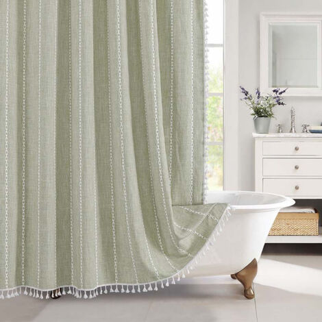 Rideau de douche en tissu vert sauge, demi-taille, étroit, en coton et lin, avec pompons, pour une salle de bain chic, moderne et champêtre.