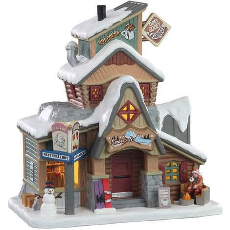 Ristorante S'Mores & Neve, edificio illuminato per villaggio di Natale in porcellana