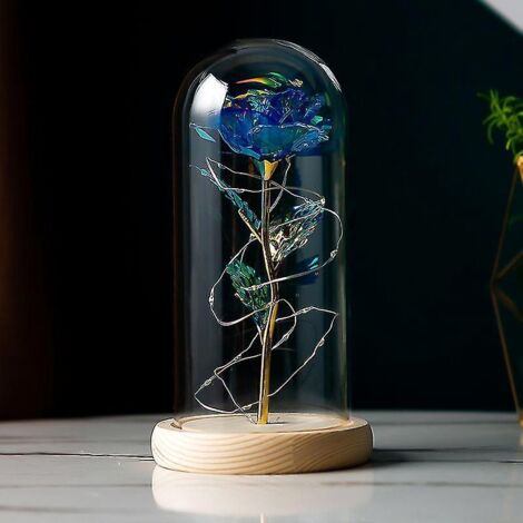 Rose éternelle de La Belle et la Bête sous dôme de verre, illuminant la lumière LED bleue.