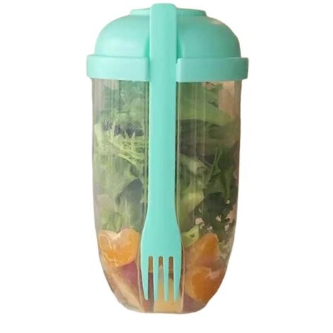 Salade de petit-déjeuner en pot, yaourt avec cuillère et couvercle vert