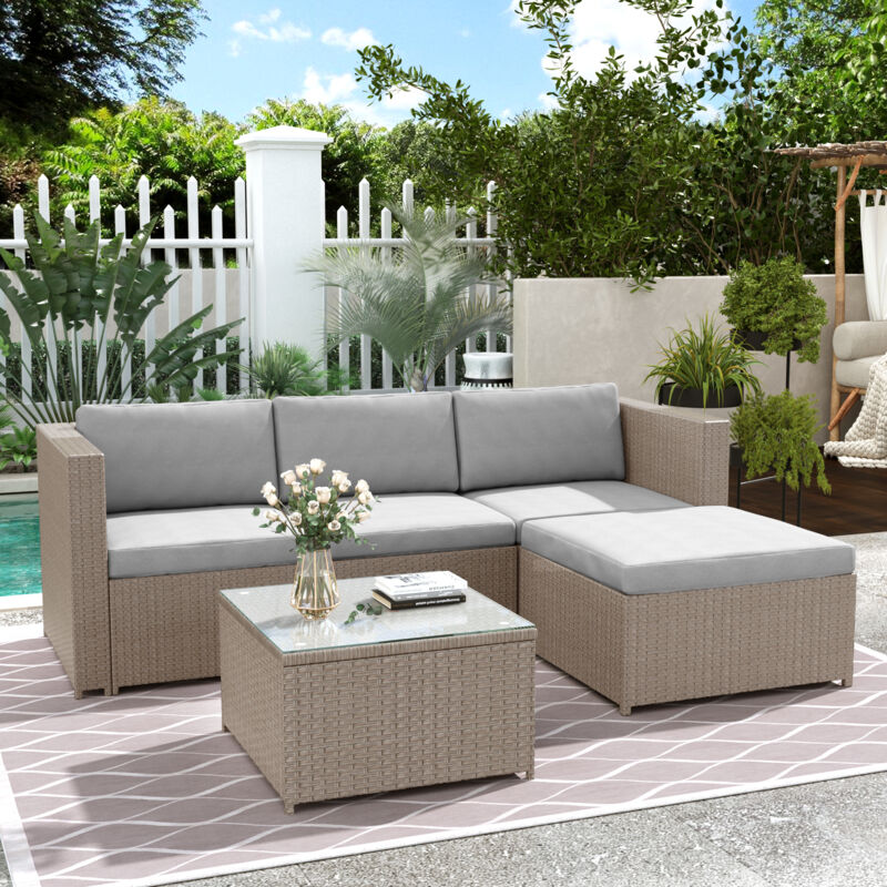 Salon de jardin en rotin avec table basse carrée en verre 58×58×36 cm, canapé d'angle modulable, coussins gris clair, structure acier