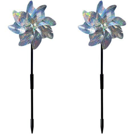 Seis molinos de viento reflectantes para protección de aves y una decoración reflectante para proteger del impacto al huerto.