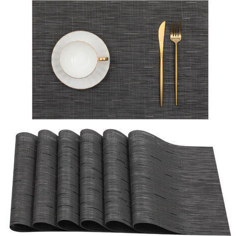 Set mit 6 schwarzen Tischsets für Esstische. Abwaschbare Tischsets aus hitzebeständigem PVC, 45 x 30 cm.