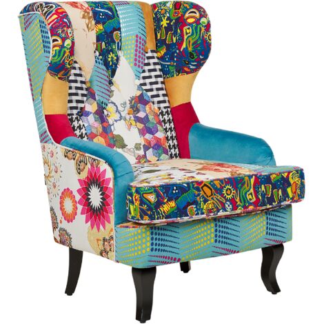 Sillón orejero tapizado en tela multicolor retazos acolchado con botones patas de madera azul Molde