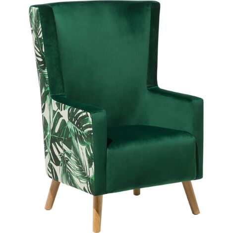 Sillón orejero tapizado en terciopelo verde blanco patrón de jungla respaldo alto patas de madera Oneida