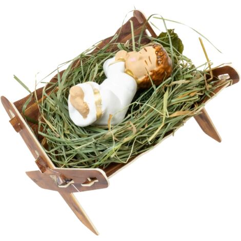 Statuina dipinta a mano raffigurante Gesù Bambino in una mangiatoia con fieno. Perfetta per il presepe natalizio.