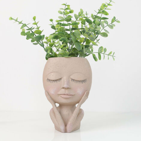Vaso per piante con viso stilizzato in ceramica