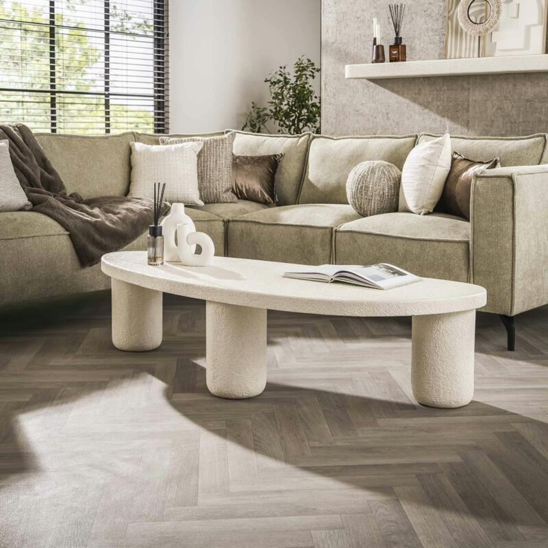 Table basse blanche en marbre composite forme galet taj