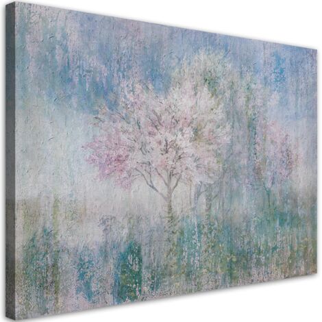 Tableau sur toile Un arbre en fleurs dans la prairie ancienne et sale 60x40