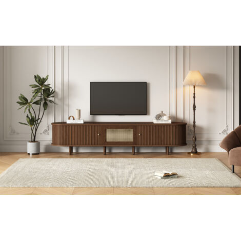 Tablette de télévision ovale, en bois de noyer de couleur foncée, avec un design en rotin. Longueur : 180 cm. Structure en MDF. Pieds réglables. Capacité de charge : 30 kg.