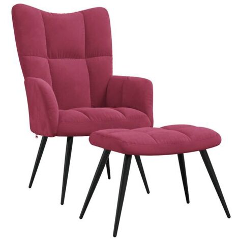 Une chaise longue avec repose-pieds, en velours bordeaux.