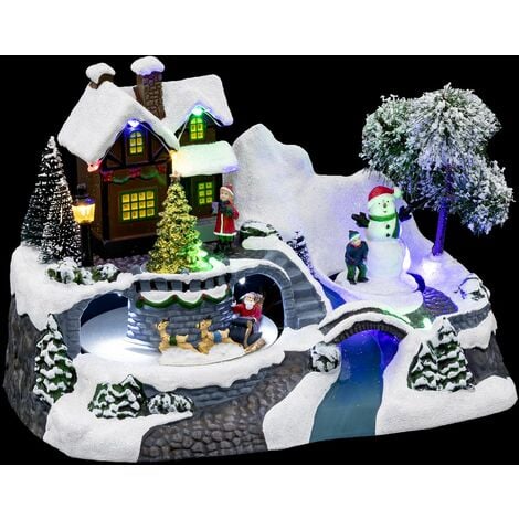 Village de Noël enneigé avec le Père Noël - Longueur 23,8 x Profondeur 15 x Hauteur 16,1 cm - Blanc