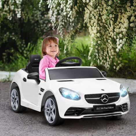 Voiture électrique pour enfants. avec phares LED. ceinture de sécurité. klaxon. musique. vitesse de 3 à 5 km/h. blanche. 107 x 62.5 x 44 cm
